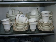 A good quantity of Sheridan dinner and tea ware, white with gold bands.
