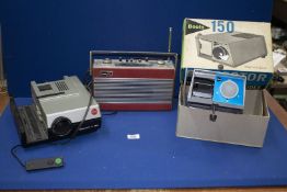 A Leica Pradouit P150 slide Projector, boxed Boots 150 Projector and a Roberts Radio.