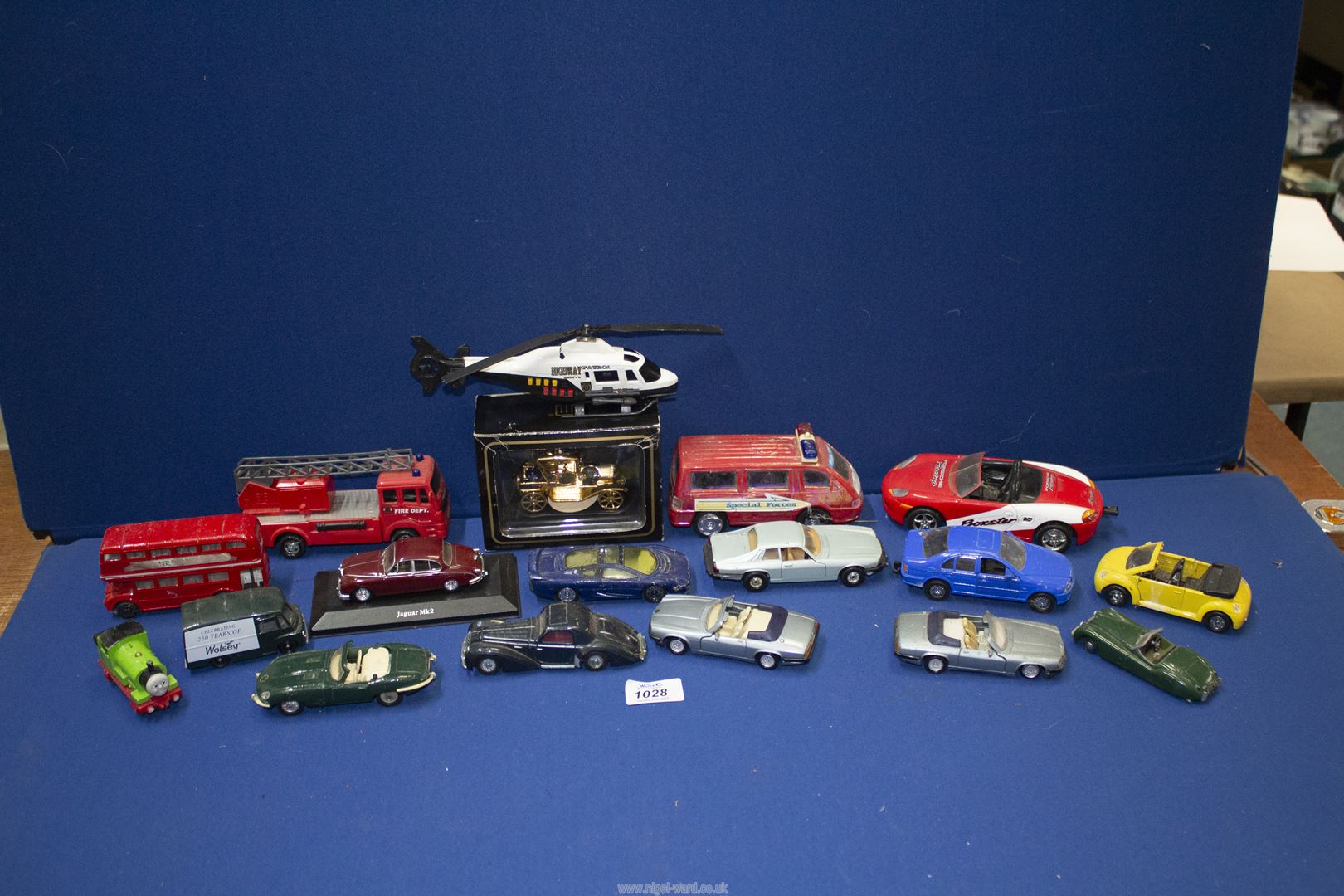 A quantity of model vehicles including M.C Toys, Matchbox, Lledo etc, cars, buses, helicopter, etc.