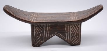 A Tribal art Namji prestige stool/neck-rest with incised decoration, Cameroon, 16" long.