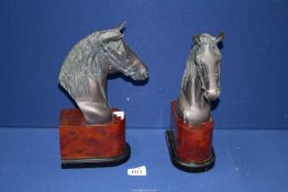 A pair of nicely modelled metal Horse head bookends on plinths, 11 1/2" tall.