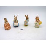 Four Royal Albert Beatrix Potter figures to include Mrs Rabbit, Poorly Peter Rabbit,