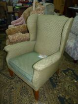 A Wing Fireside Armchair upholstered in lattice patterned green upholstery - Parker Knoll model No.