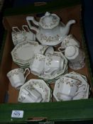 An Eternal Beau tea set for twelve to include cups and saucers, tea plates and teapot.