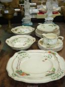 An Alfred Meakin 'Marigold, Astoria Shape' part dinner service to include five dinner plates,
