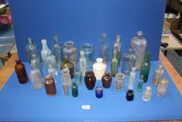 A quantity of bottles including; Davies Brookes Hereford, Pattersons Glasgow, Poison jars, etc.