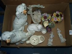 A box of china to include a courting couple on a swing, two posy bowls, white cat,
