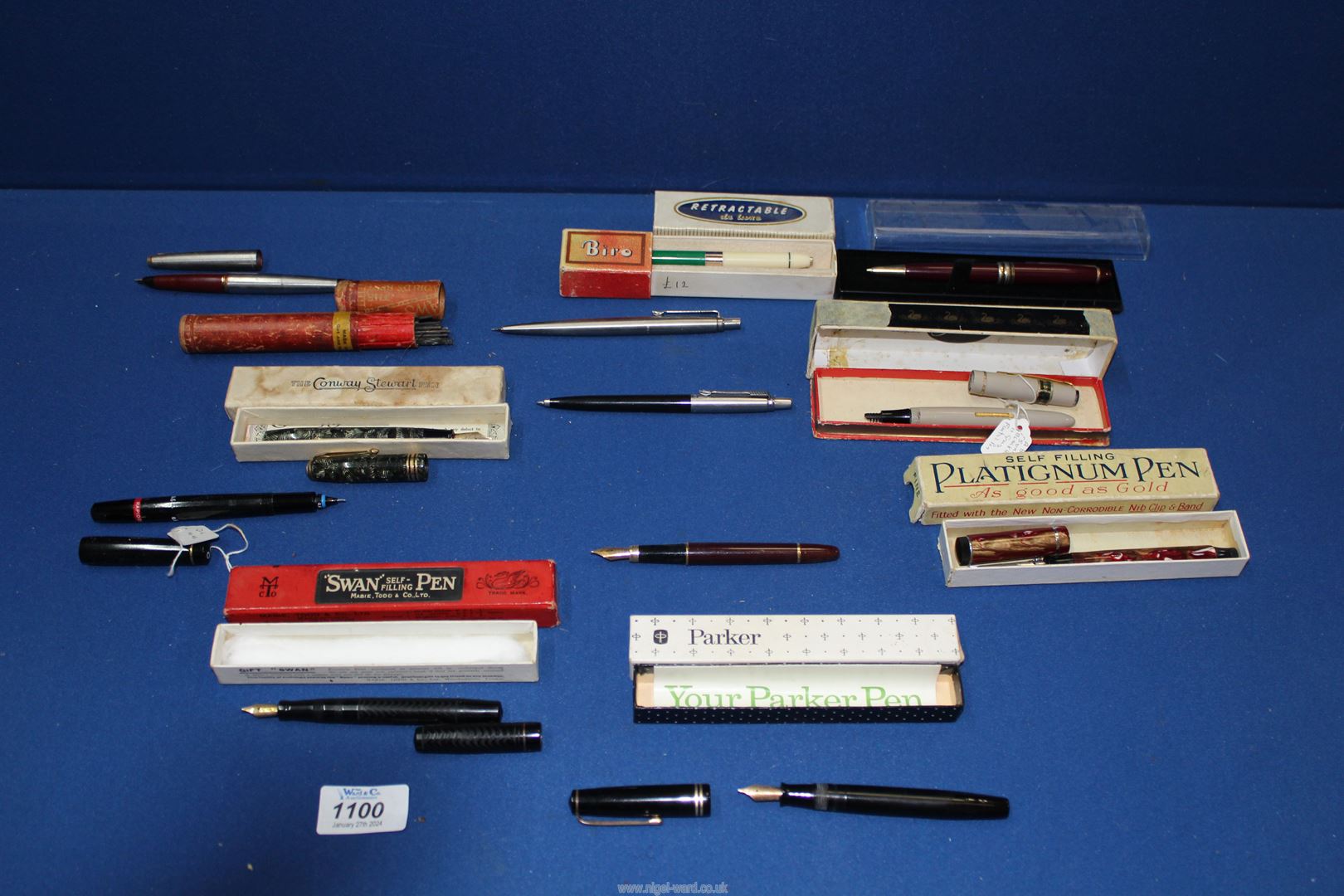 A quantity of boxed pens including Swan, Parker etc,