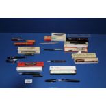 A quantity of boxed pens including Swan, Parker etc,