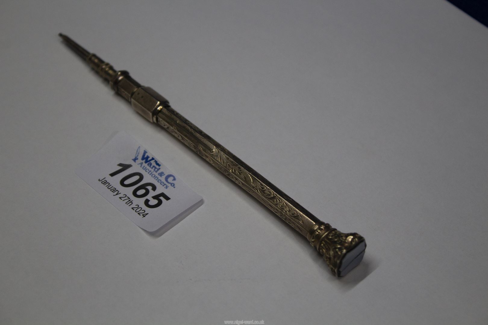 A propelling Pencil with a gold coloured hexagonal engraved barrel and hardstone inset, - Image 3 of 3