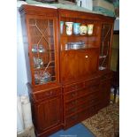 A contemporary Yew wood breakfront Lounge Unit with a drinks cabinet flanked by 13 panel glazed