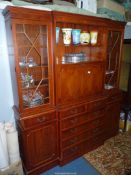 A contemporary Yew wood breakfront Lounge Unit with a drinks cabinet flanked by 13 panel glazed