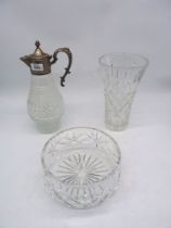 A large cut glass vase having trellis design, a cut glass fruit bowl and a claret decanter.