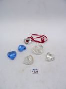 Six Swarovski heart ornaments including; 2004 Christmas tree decoration, two blue, one with a bow,