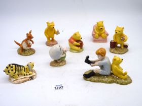 A quantity of Royal Doulton figures to include Christopher Robin and Pooh,