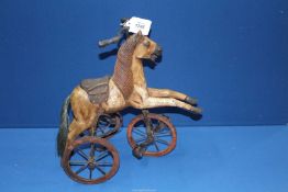 A small toy horse velocipede, 14 1/2" tall.