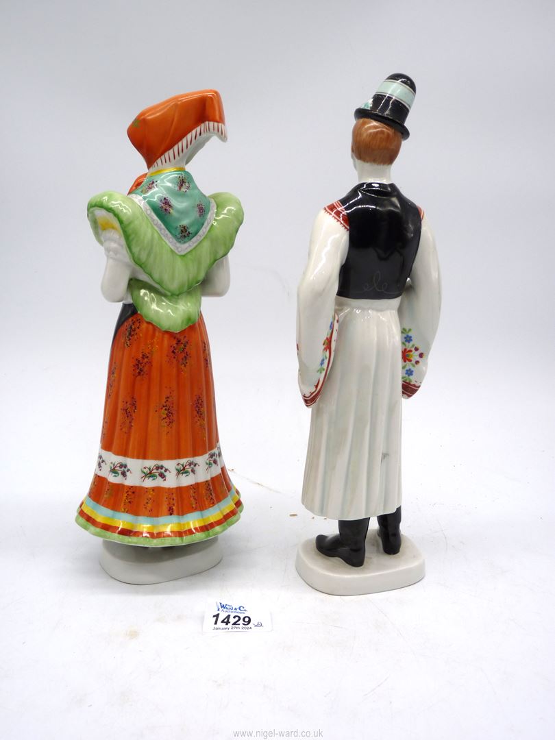 Two Hollohaza porcelain figures of a lady and gent in traditional dress. - Image 2 of 3