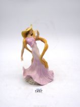 An Art Deco style figure of a Dancing lady in pink dress, 8" tall.