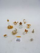 A small quantity of mixed Swarovski crystal and gold plated ornaments including; lighthouse, globe,
