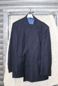 A black pinstripe double breasted suit by Austin Reed, 100% wool, jacket 48" short,