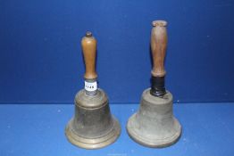 Two brass market bells.