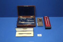 A cased set of a miscellaneous drawing instruments, two Papermate biro and pencils set,