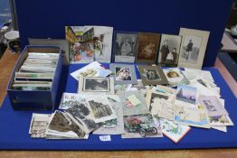 A box of old Postcards and photographs, greeting cards, etc.