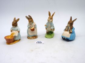 Four Royal Albert Beatrix Potter figures to include Mrs Rabbit, Bunnies, Mrs Rabbit Cooking, etc.