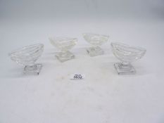 Two pairs of Waterford crystal boat shaped salts on a thick footed base.