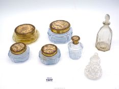 A dressing table set with tapestry inset lids and two perfume bottles with stoppers.