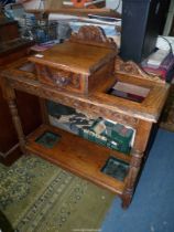 A mid Oak Hallstand/Umbrella stick Stand with a fearsome mask handled glove drawer and complete