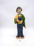 A Chinese pottery figure after a model of a Court lady from the Tang dynasty, 16 1/2" tall.