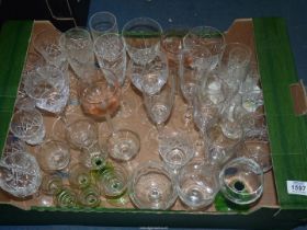 A quantity of glasses including champagne flutes, wine, brandy and liqueur glasses.