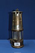 A miner's/Davy Lamp by the Protector Lamp & Lighting Co. Ltd.