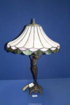A Tiffany style table Lamp in the form of a nude lady with pretty pink shade having green and pink