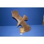 A contemporary carved figure of an Eagle, 15 1/2" high.