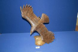 A contemporary carved figure of an Eagle, 15 1/2" high.