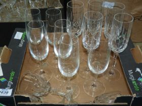 A small quantity of champagne flutes and wine glasses.