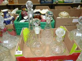 Four glass decanters including conical, etched, etc., chip to base on one.