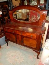 A circa 1930/40 Mahogany mirror backed Sideboard having quarter veneered details to the doors and