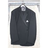 A Gents dinner suit; jacket 50" chest short length, trousers 46" waist 29 1/2" leg.