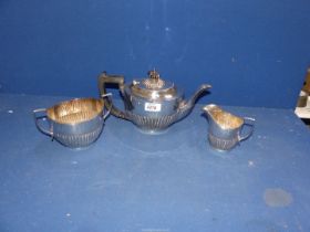 A three piece silver plated Teaset in half ribbed pattern.