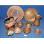 An assortment of copper items to include; teapot, vases, bowls, etc.
