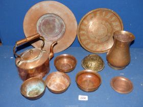 An assortment of copper items to include; teapot, vases, bowls, etc.