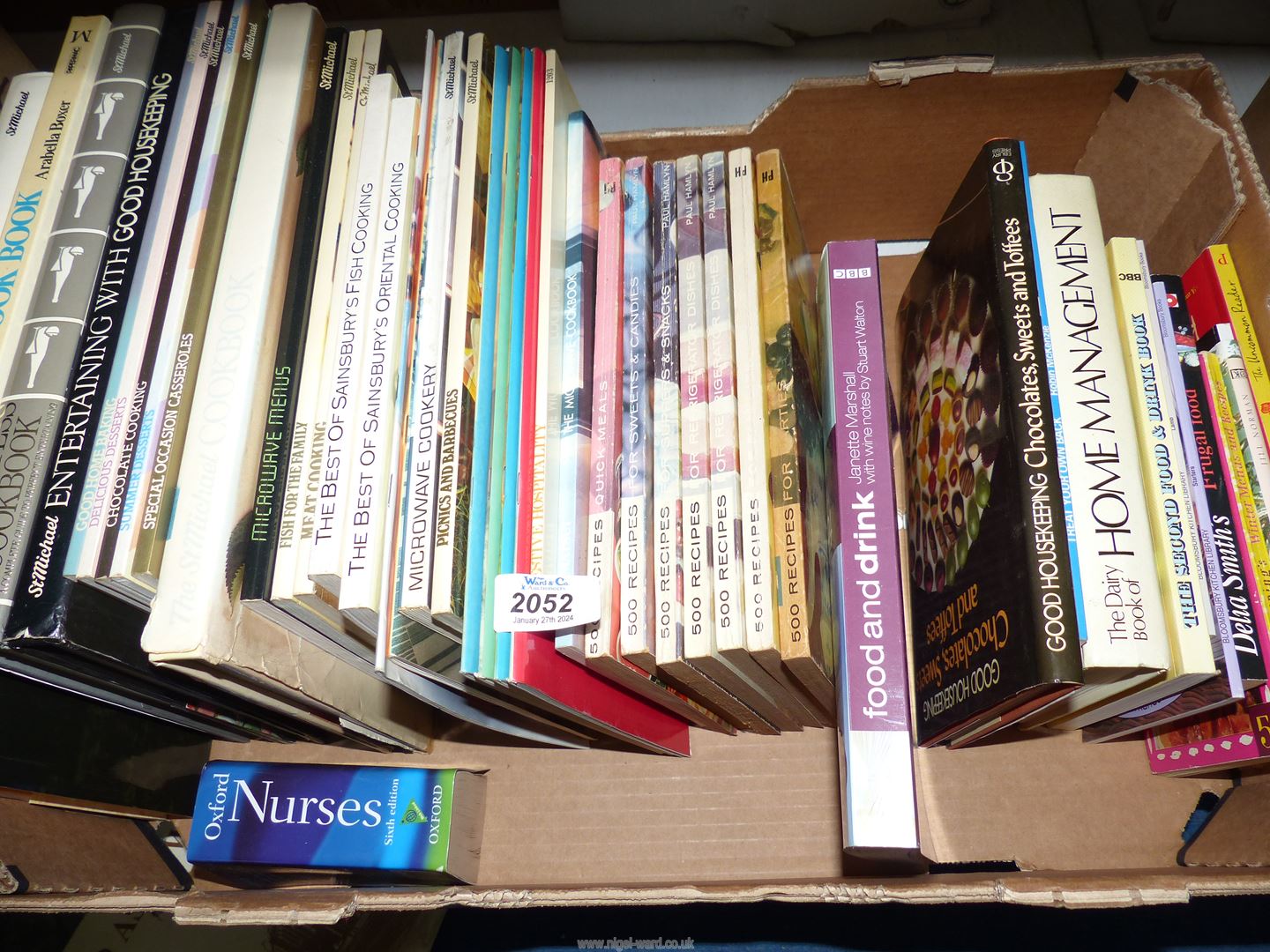 A quantity of cookbooks and home management books.