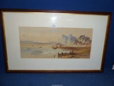 A framed and mounted Watercolour depicting a seascape with boats, figures and rugged cliffs,