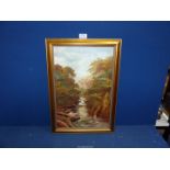 A gilt framed Oil on canvas depicting a river landscape having tree lined banks,