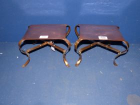 A rare pair of late 19th century heavy copper Arts & Crafts kettle trivets standing on scroll shape