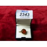 A 9ct gold ladies ring, set with a large orange stone, 3.8g.