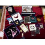 A box of costume jewellery including dress rings, bookmarks Poppy necklace, beaded bracelets etc.